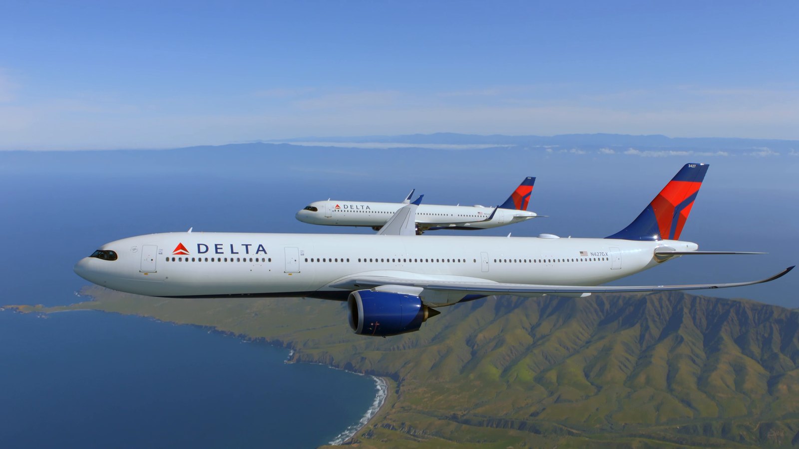 Two Delta aircraft flying in formation